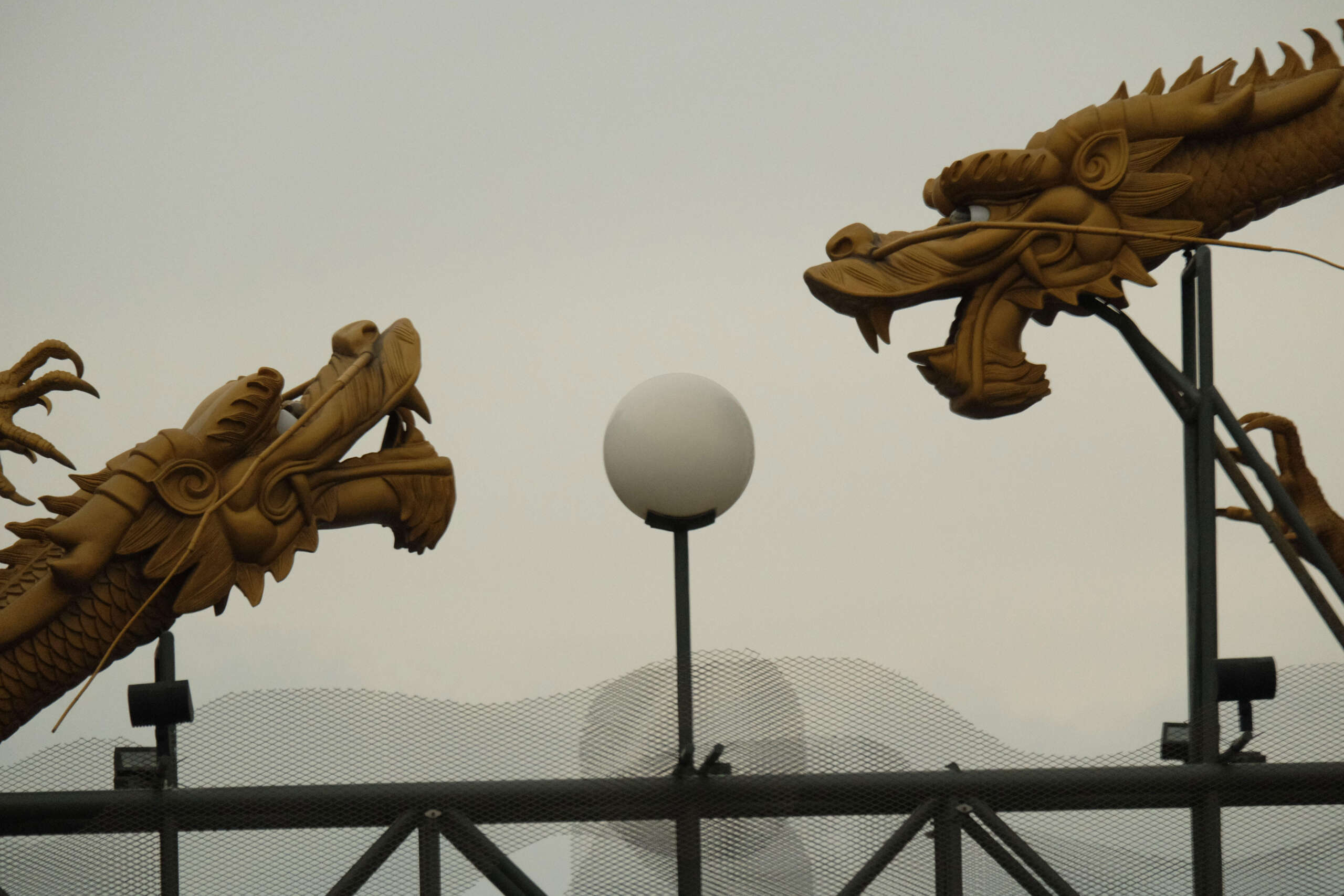 An art installation of a pearl between two dragons from Los Angeles's Chinatown.